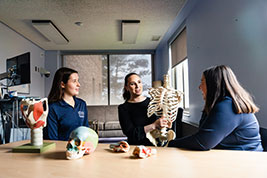 Students with a fake skeleton. Links to Gifts of Cash, Checks, and Credit Cards